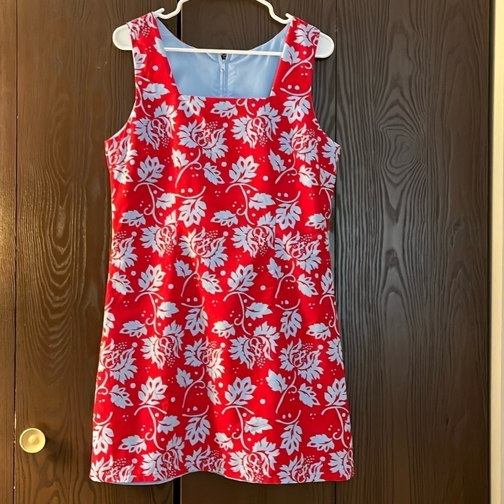 No tag sleeveless red dress with blue floral design. Size Medium